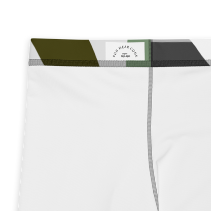 Close-up of a white athletic leggings with a brand label 'Funwearcode', with green and black trim on a white background