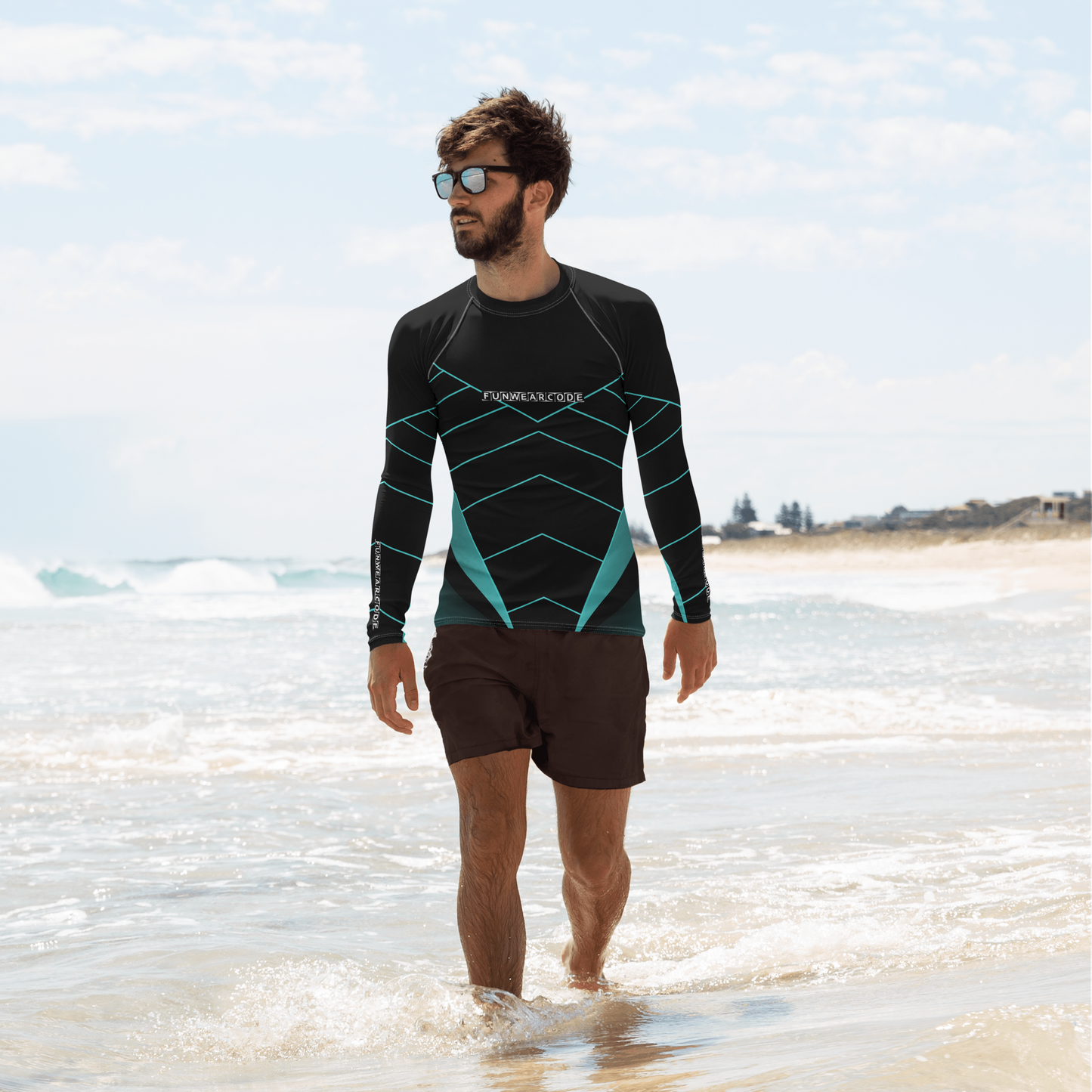 Man wearing a  "Fun Wear Code" branded black and green wetsuit on a beach