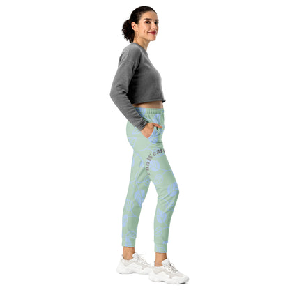 Woman wearing a gray sweatshirt and light blue leggings with a pattern and 'Fun Wear Code' text logo on a white background