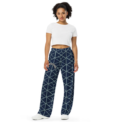 Woman wearing navy blue pants with white geometric pattern and a 'Fun Wear Code' text logo on a white background
